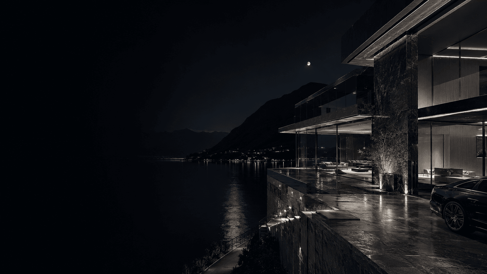 A discreet private residence overlooking Lake Como at night